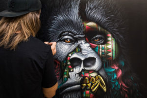Sonny paints his gorilla canvas for his To The Bone exhibition in his studio in South Africa
