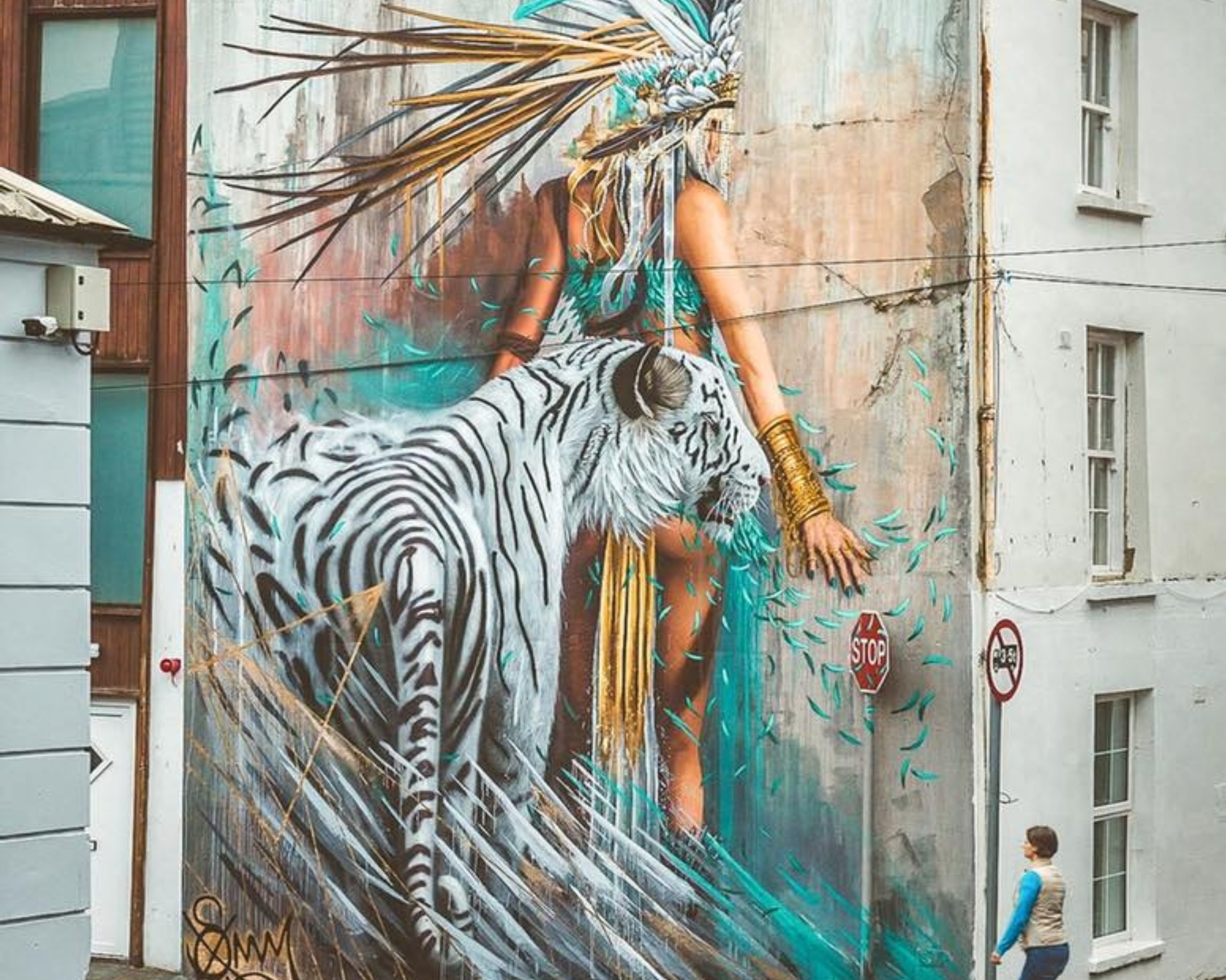 Sonny Street Art Mural of girl and white tiger painted in the streets of Ireland for Waterford Walls Festival 2018